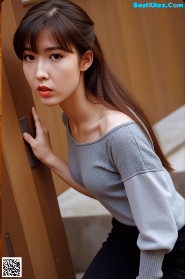A woman leaning against a wooden door with her hand on the door handle.
