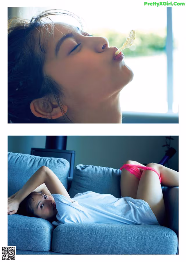 A woman laying on a couch eating a piece of food.