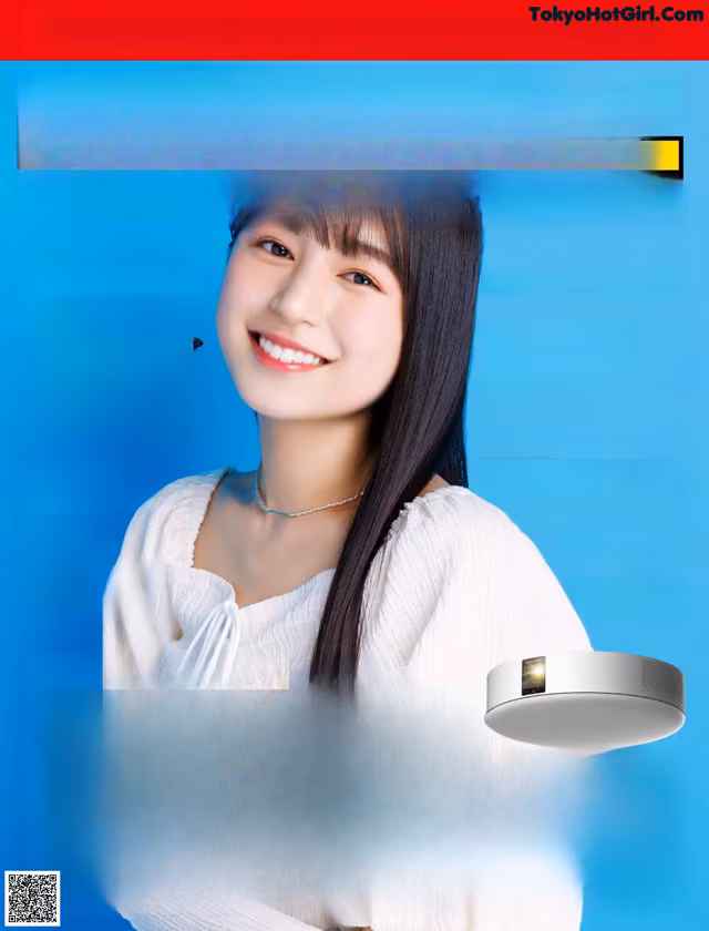 A magazine with a picture of a woman smiling.